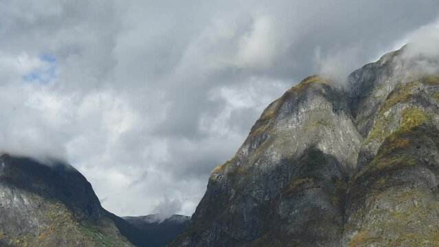 View up the autmn summits of Sognefjord,  Aurlandsfjord Flam, Norway. Impressive mountain landscape of fjords 
