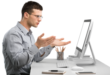 Young Caucasian man worker speak in glasses look at computer operational problems. Frustrated man surprised by unexpected error on computer device.