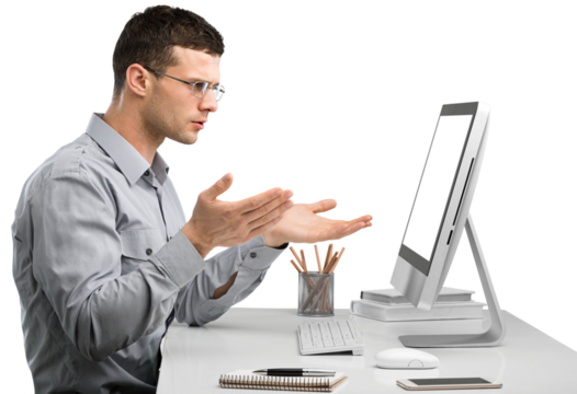 Young Caucasian man worker speak in glasses look at computer operational problems. Frustrated man surprised by unexpected error on computer device.