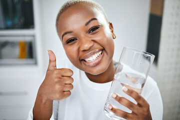 Thumbs up, yes and portrait of black woman with water for diet success or detox start. Happy,...