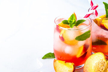 Peach cocktail, iced peach tea, fruit drink.