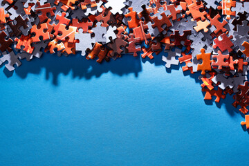 Mixed Peaces of a Colorful Jigsaw Puzzle Lie on the Blue Background With Copy Space - Strategy and Solving Problem Concept