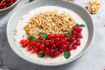 Oatmeal. Granola with yogurt and red currant
