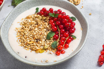 Oatmeal. Granola with yogurt and red currant

