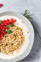 Oatmeal. Granola with yogurt and red currant
