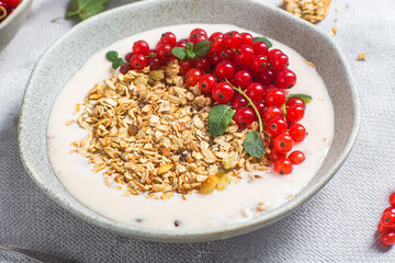 Oatmeal. Granola with yogurt and red currant
