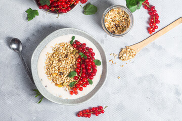 Oatmeal. Granola with yogurt and red currant
