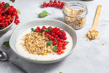 Oatmeal. Granola with yogurt and red currant
