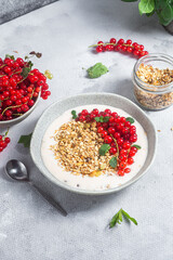 Oatmeal. Granola with yogurt and red currant
