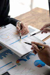 The sales department is having a monthly summary meeting to bring it to the department manager, they are verifying the correctness of the documents that are prepared before bringing in to the manager