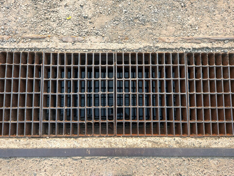rusty iron grate of water drain