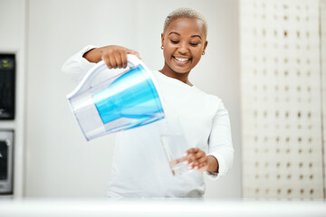 Black woman, pitcher and glass with water filter for clean and fresh purification at home. Happy...