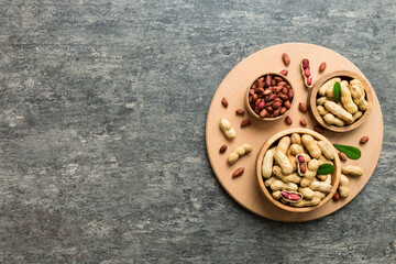 Fresh healthy peanuts in bowl on colored table background. Top view Healthy eating bertholletia concept. Super foods