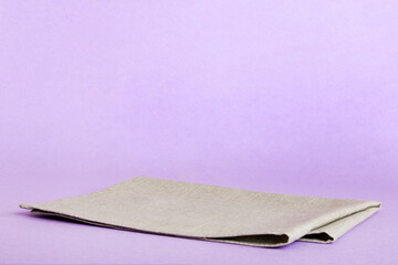 top view with gray kitchen napkin isolated on table background. Folded cloth for mockup with copy space, Flat lay. Minimal style