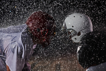 Two american football players face to face in silhouette shadow on white background