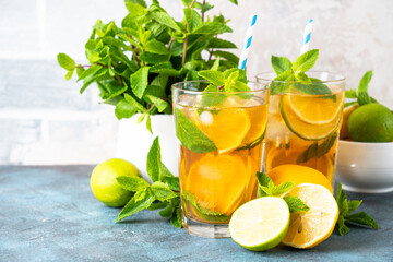 Fototapeta premium Iced tea with lemon, lime, mint and ice.