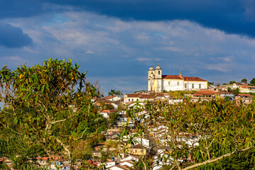 Historic church on top of the hill among the houses in the city of Ouro Preto in the state of Minas Gerais