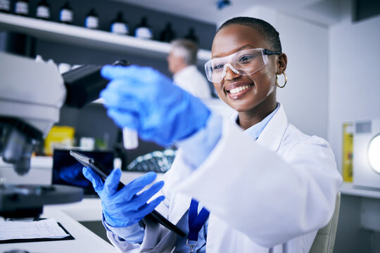 Black woman, test tube or happy scientist with tablet for pharmaceutical research, innovation or medicine. Medical data, smile or African biologist in science analysis in laboratory studying a cure