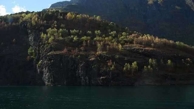 View from an electrical cruise ship on Sognefjord,  Aurlandsfjord Flam, Norway. Impressive mountain forestry  landscape of fjords and blue water