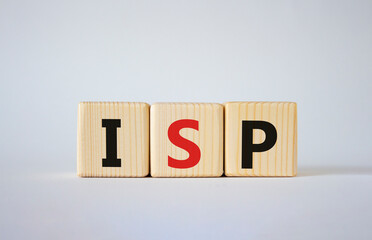 ISP - Internet Service Provider symbol. Concept word ISP on wooden cubes. Beautiful white background. Business and ISP concept. Copy space.