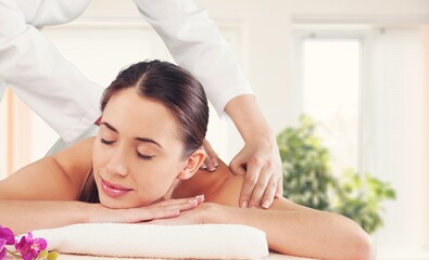 Obraz na płótnie Canvas Beautiful young Woman Enjoying Massage In Salon