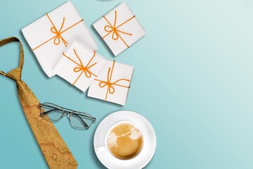 Elegant gift box, coffee mug, accessories on desk