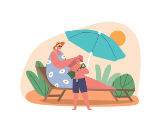 Mother Placed A Panama Hat On Her Young Sons Head As They Enjoyed Their Time On The Beach, Protecting Him From The Sun