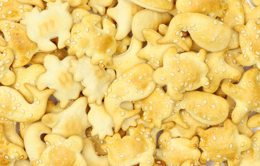 Sea animals shaped sesame sprinkled crackers full texture background