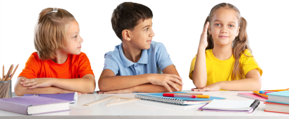 Concept of education. Elementary school child, ready to answer the teacher's questions in class. Smart little is sitting at a desk next to her classmate in the classroom.