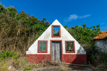 Ruins of a traditional triangular madeiran house in the island of Madeira, Portugal