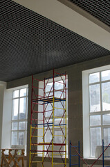 lattice ceiling.suspended ceiling.scaffolding for the installation of a suspended ceiling in the room.