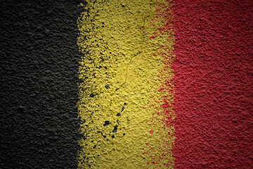 painted big national flag of belgium on a massive old cracked wall