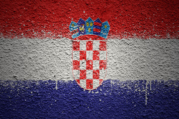 painted big national flag of croatia on a massive old cracked wall