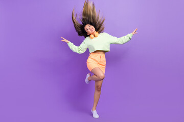 Portrait of optimistic nice pleasant girl wear stylish pullover skirt flying hold arms like wings...