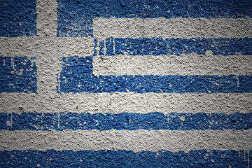 Fototapeta na wymiar painted big national flag of greece on a massive old cracked wall