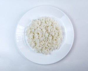 Cooked white rice on a plate and isolated on white background