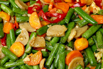 Top view and whole frame from indonesian food stir fry long bean or tumis kacang panjang and sliced meatballs.