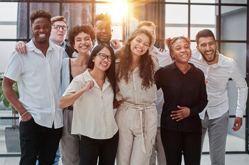 Team at work. Group of young business people in smart casual wear working together in creative office