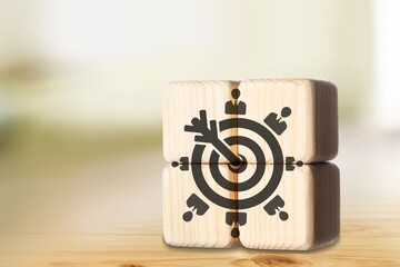 Target customer concept on wooden cubes