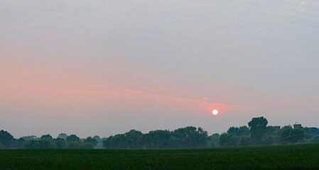 Wildfire smoke from fires burning in Canada, creates haze and clogs the sky in South Eastern...