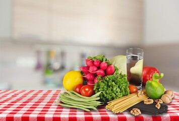 Home kitchen table with fresh vegetables