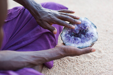 Photographs of a young black gay man practicing Reiki in the desert.  - 619526512