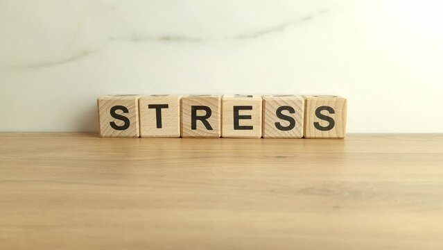 Word stress from wooden blocks. Mental health concept
