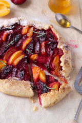 Apricot and plum galette on the table