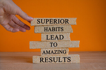 Good habits symbol. Brick blocks with words Superior habits lead to amazing results. Beautiful...