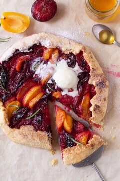 Apricot and plum galette on the table
