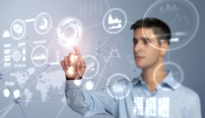 Man touchs a HUD virtual screen with financial anlytics graphs. Digital data management system concept