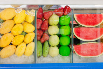 Fruit in showcase, Mixed Fruit for sale on the roadside, Fresh fruits shop cart street food in thailand