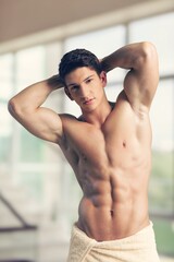 Handsome muscle sporty young man posing