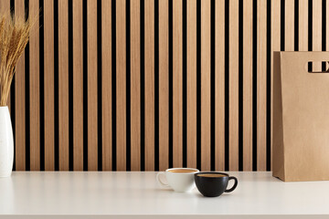 Espresso coffee on the table and wood wall background